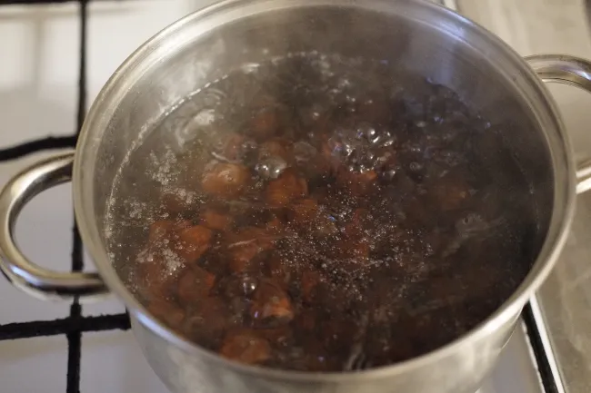 Acorns boiling in a pot