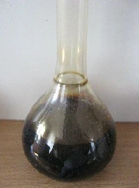 Cashew nut shell liquid in a flask