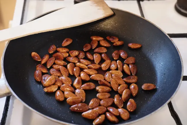 The toasted almonds in the pan after seven minutes