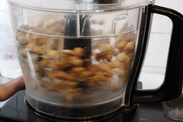 Hazelnuts being pulsed in a blender