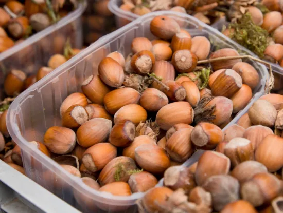 Boxes of in-shell hazelnuts at the local farmers market